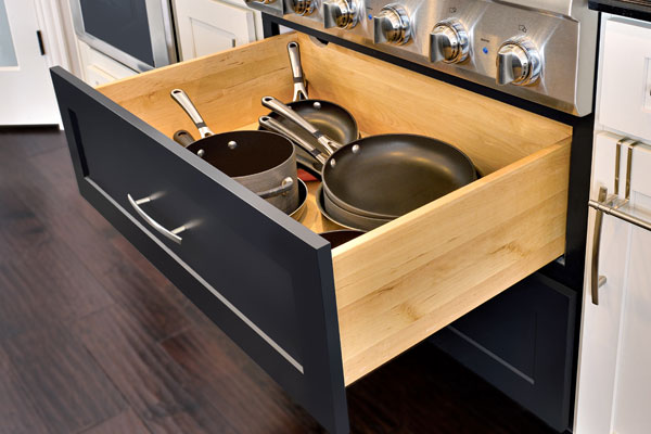 CliqStudios Dayton pots and pans cabinet in Painted Carbon storing black cookware